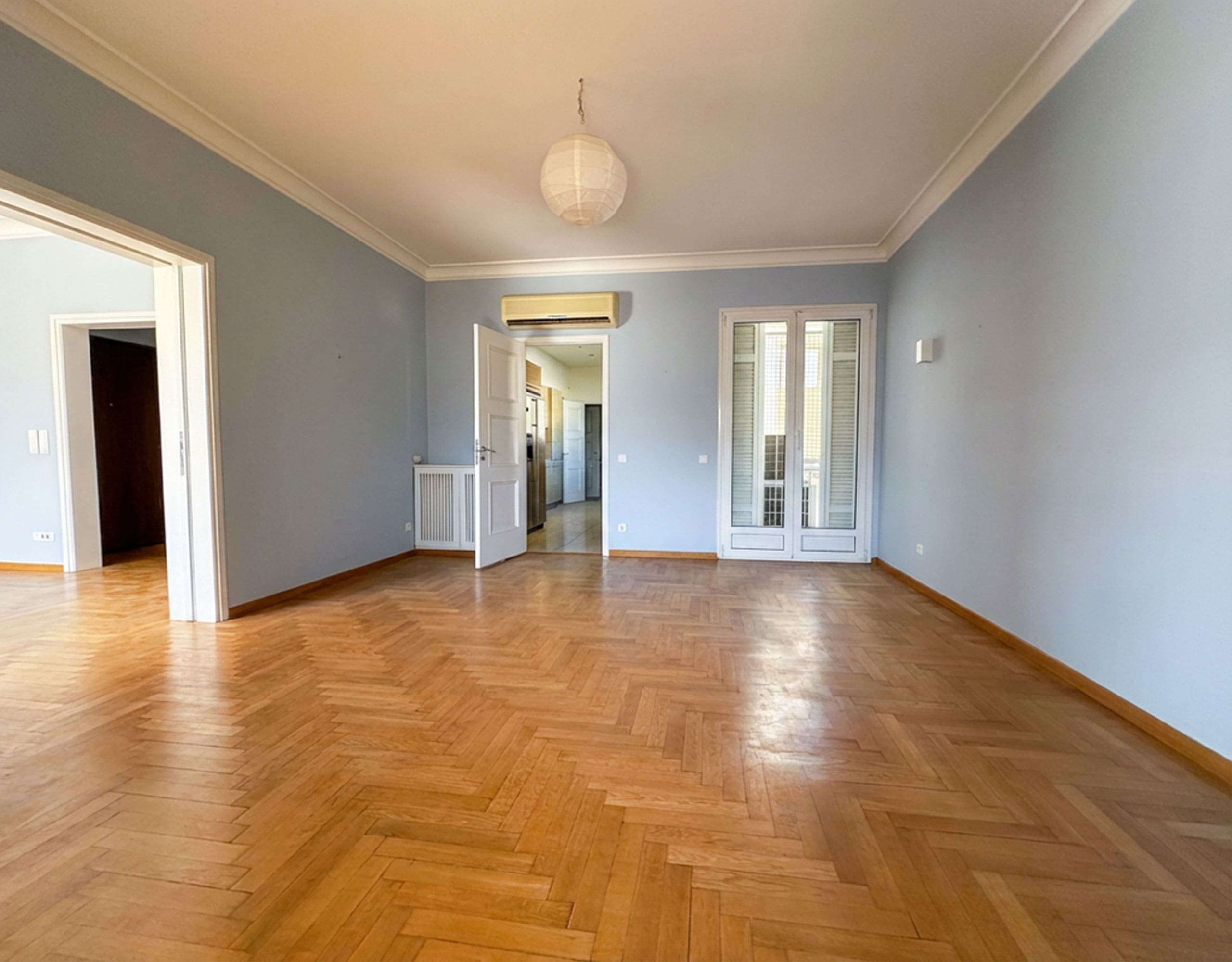 Spacious empty room with wood flooring and doorway to the hallway, Anaktora, Kolonaki, Athens, Greece