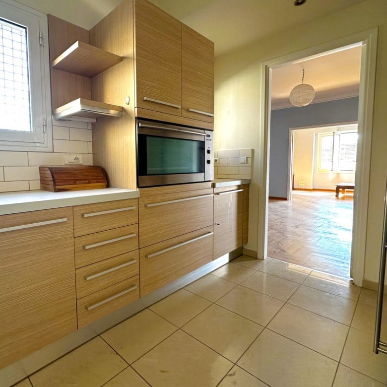 Kitchen with wood cabinets, tiled floor, and built-in shelving units, Anaktora, Kolonaki, Athens, Greece