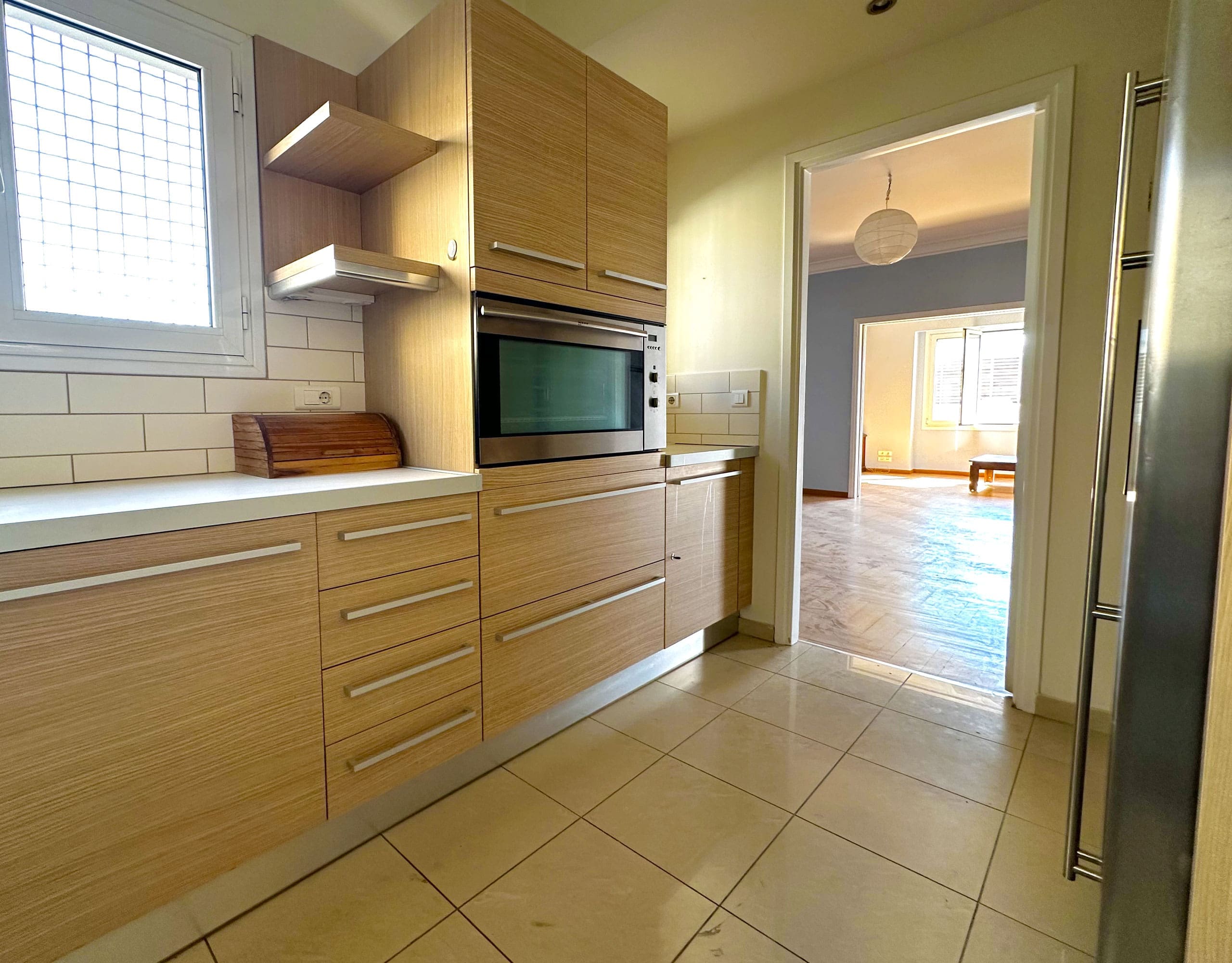 Kitchen with wood cabinets, tiled floor, and built-in shelving units, Anaktora, Kolonaki, Athens, Greece