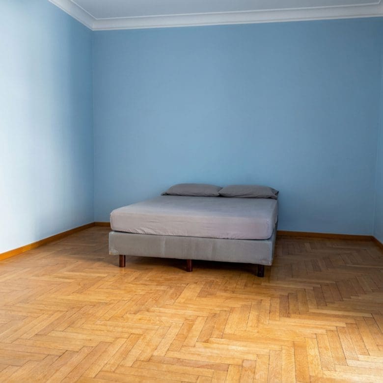 Empty bedroom with wood flooring and blue walls, Anaktora, Kolonaki, Athens, Greece