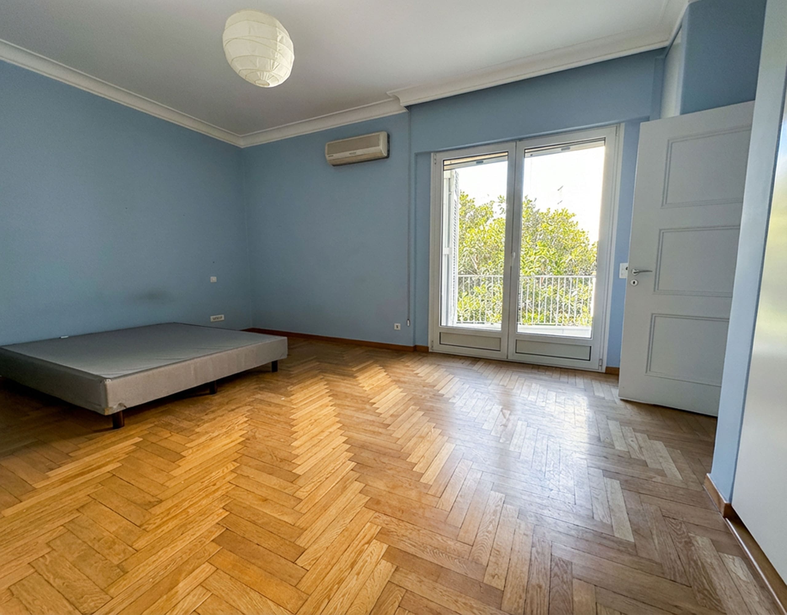 Bedroom with balcony doors, wood flooring, and natural light, Anaktora, Kolonaki, Athens, Greece