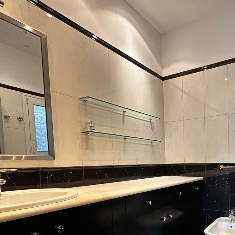 Bathroom vanity and mirror with black-and-white tile finishes, Anaktora, Kolonaki, Athens, Greece