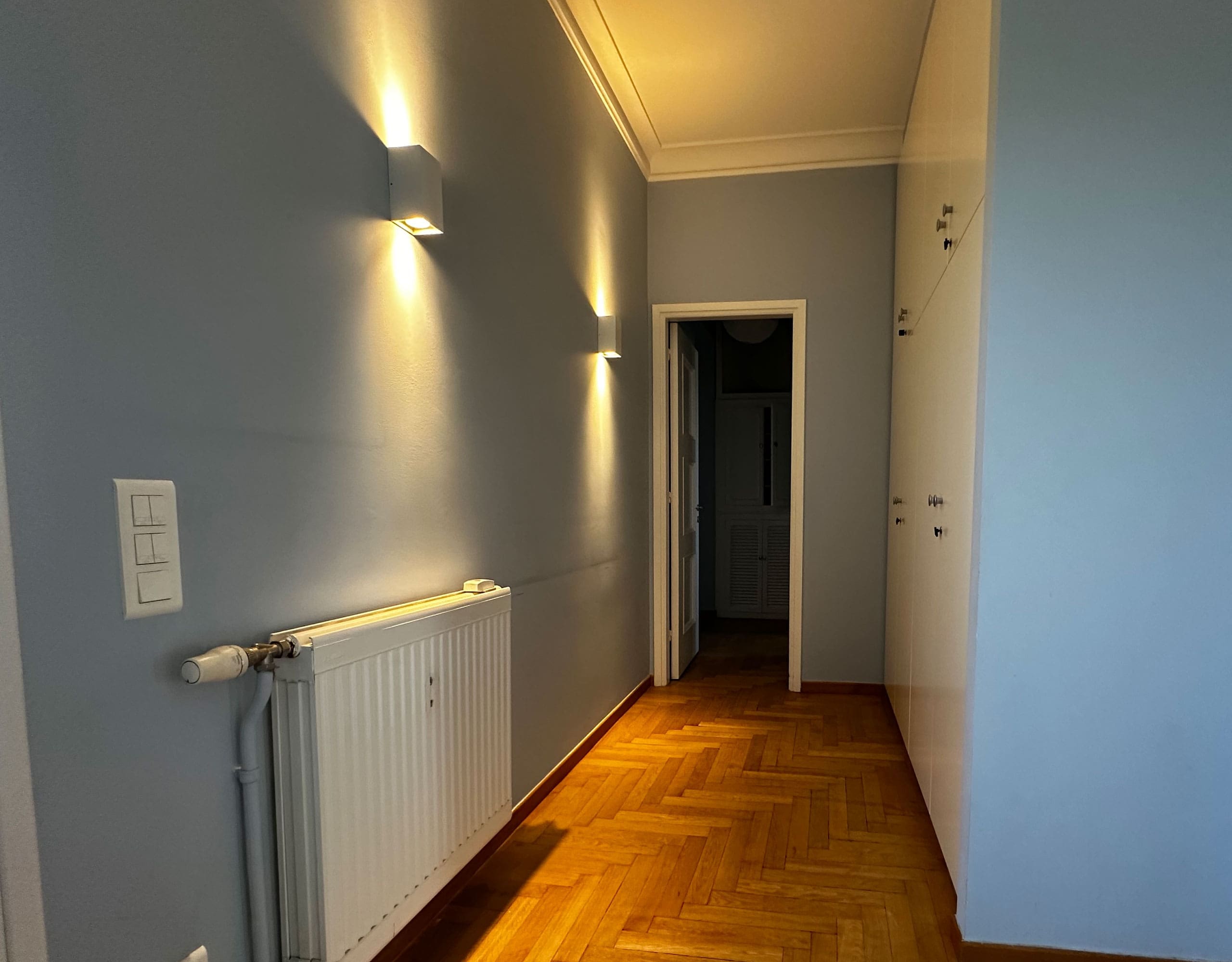 Interior hallway with wood flooring and wall lighting, Anaktora, Kolonaki, Athens, Greece