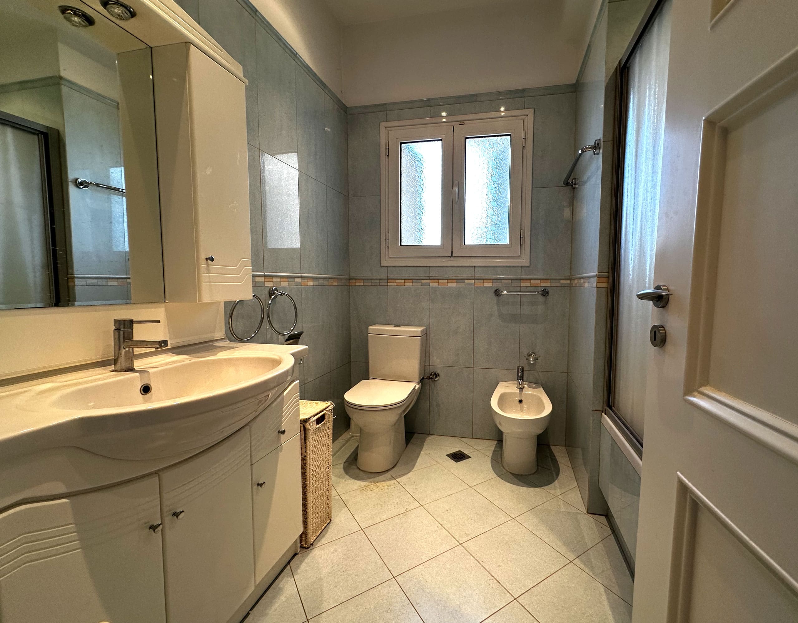Bathroom with double vanity, toilet, bidet, and window, Anaktora, Kolonaki, Athens, Greece