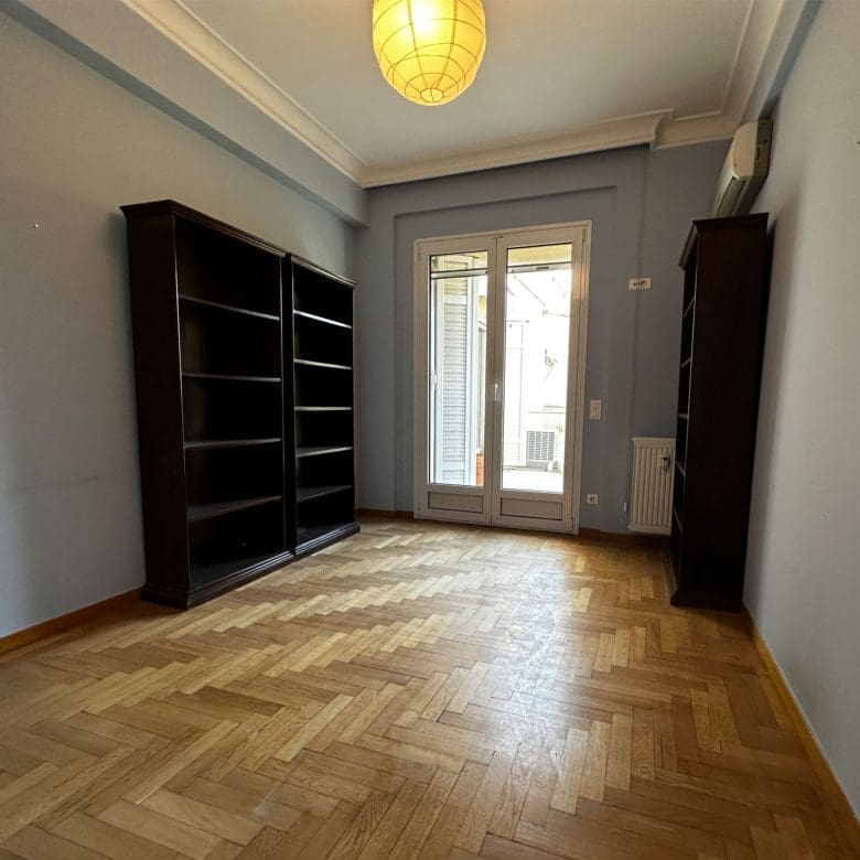 Bedroom with built-in wardrobes, wood flooring, and window, Anaktora, Kolonaki, Athens, Greece