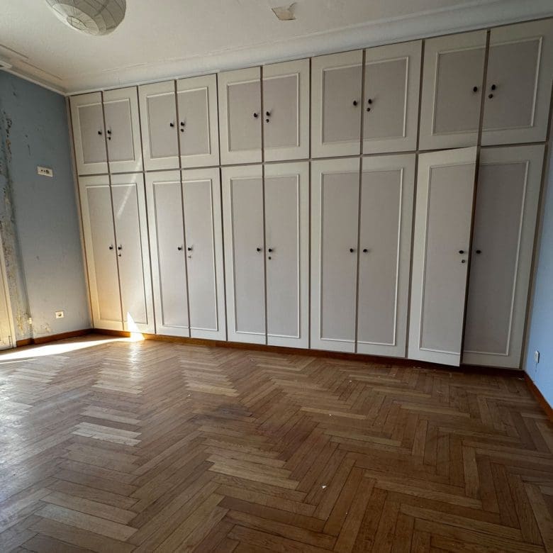 Bedroom wardrobe wall with built-in storage and wood flooring, Anaktora, Kolonaki, Athens, Greece
