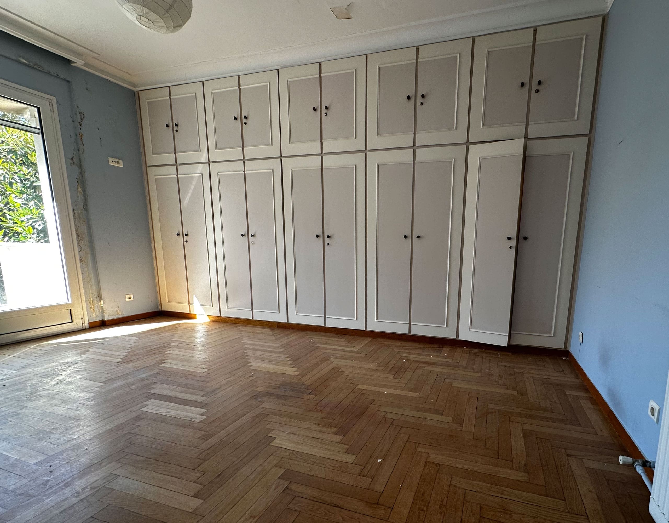 Bedroom wardrobe wall with built-in storage and wood flooring, Anaktora, Kolonaki, Athens, Greece