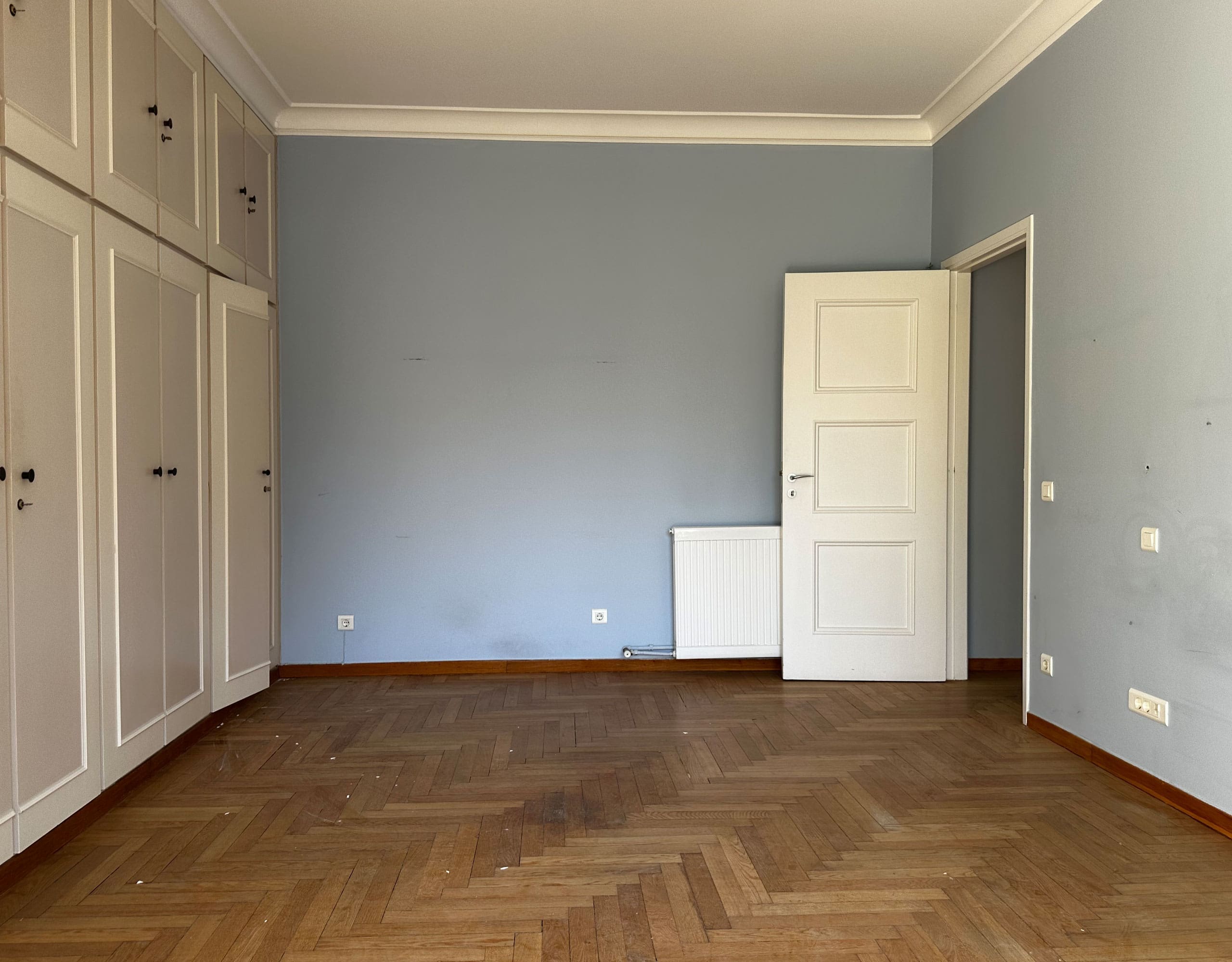 Empty bedroom with built-in wardrobes and wood flooring, Anaktora, Kolonaki, Athens, Greece