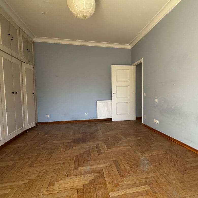 Empty room with wood flooring and built-in wardrobe doors, Anaktora, Kolonaki, Athens, Greece