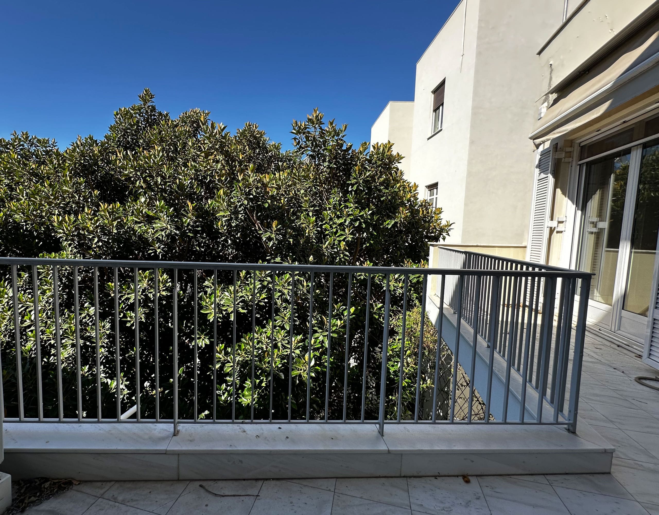 Balcony with railing and leafy view, Anaktora, Kolonaki, Athens, Greece