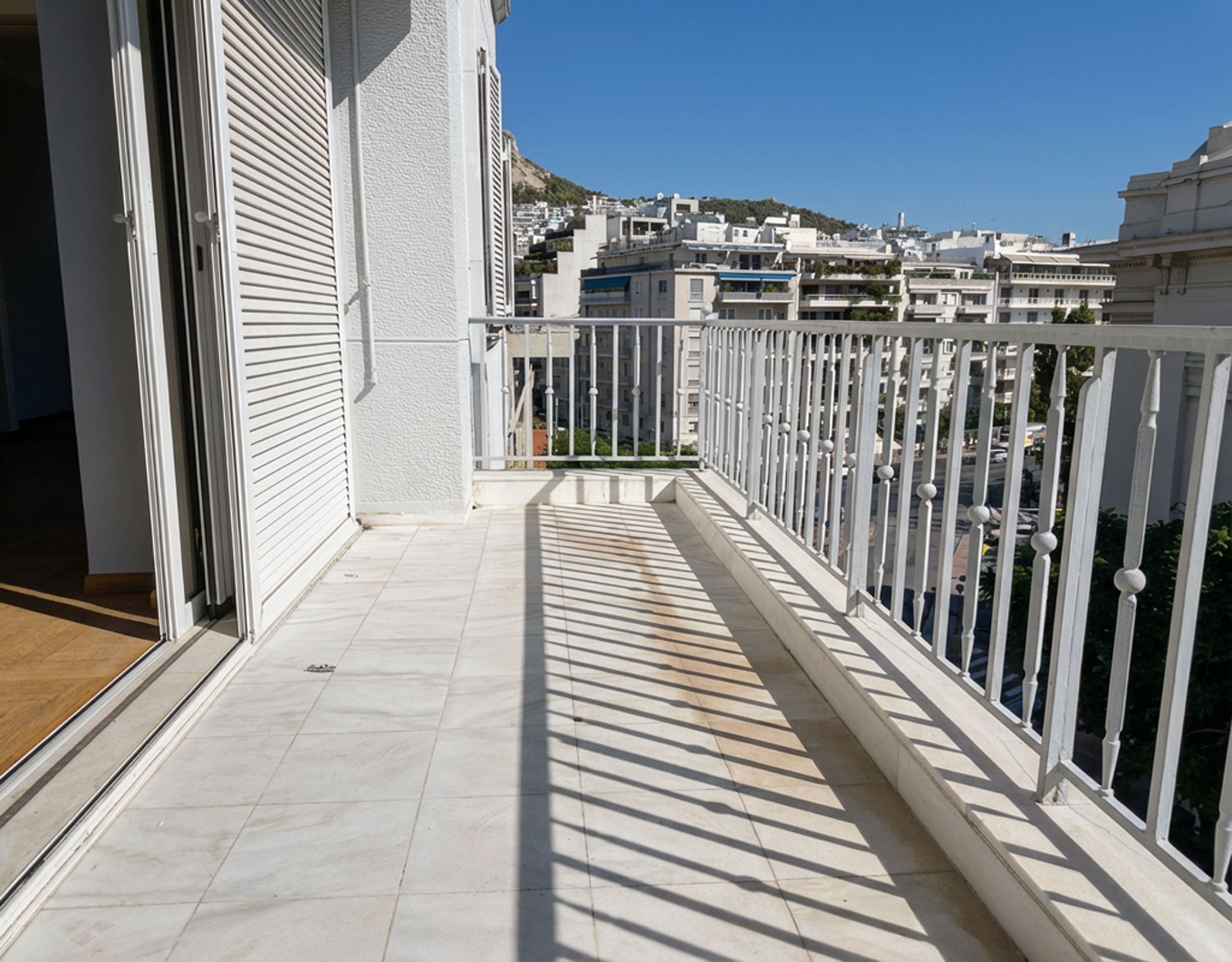 Long balcony with tiled floor, railing, and open city views, Anaktora, Kolonaki, Athens, Greece