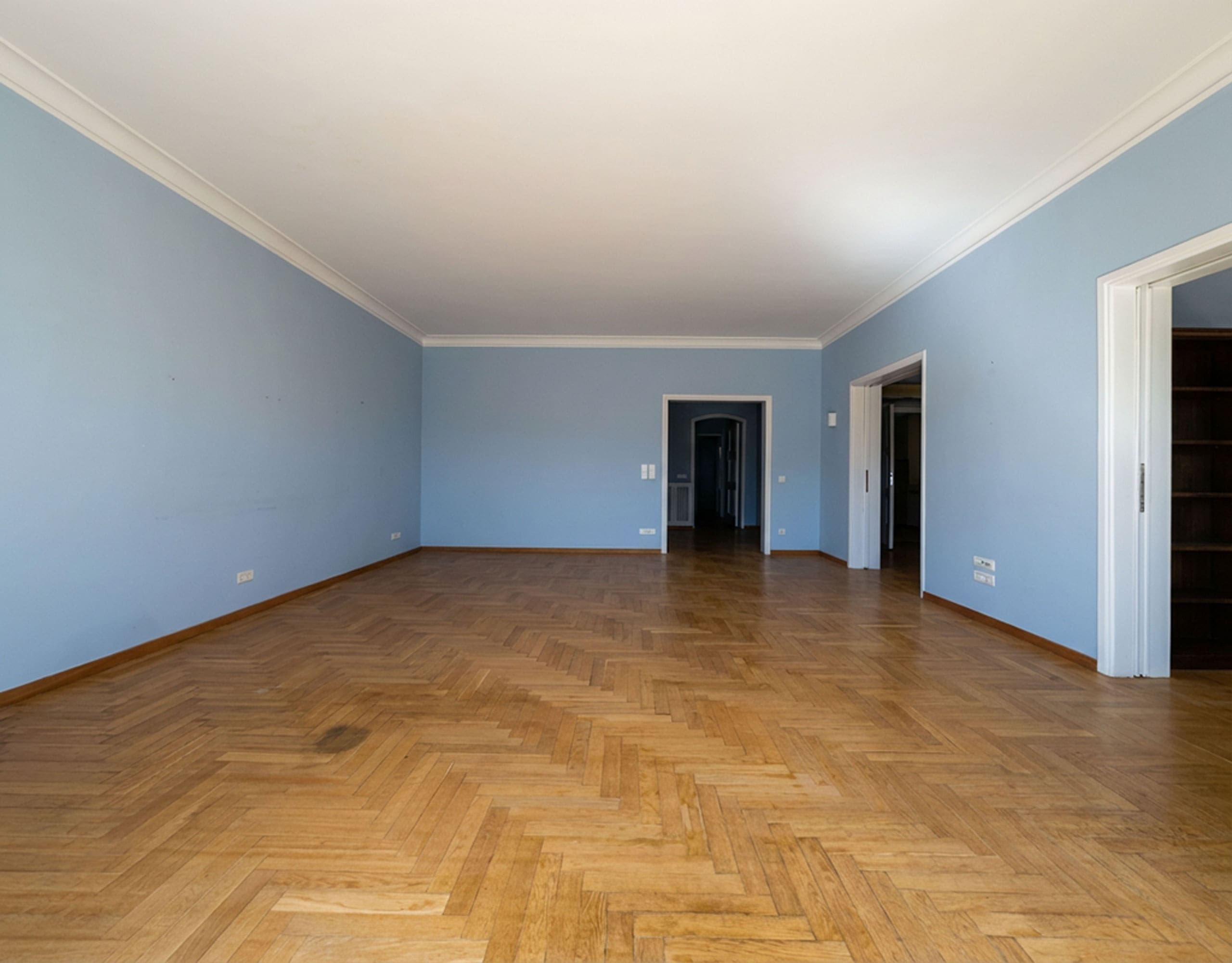 Large empty room with wood flooring and multiple doorways, Anaktora, Kolonaki, Athens, Greece