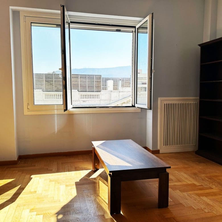 Bright room with wood flooring, open window, and city view, Anaktora, Kolonaki, Athens, Greece