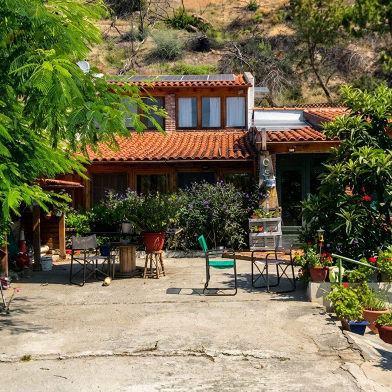 Dining area with table and built-in storage in hotel property in Limi, Evia