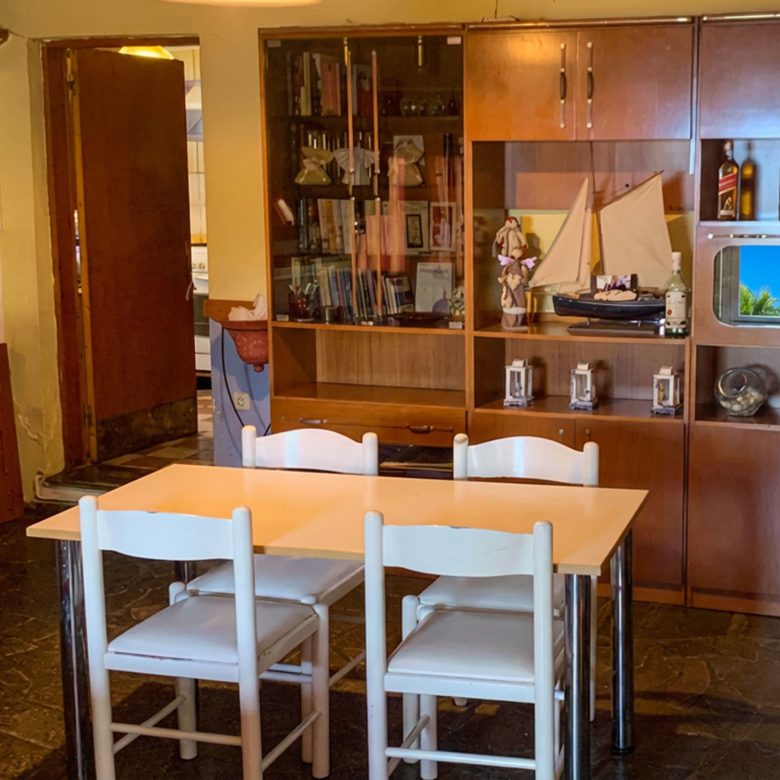 Dining area with table and built-in storage in hotel property in Limi, Evia