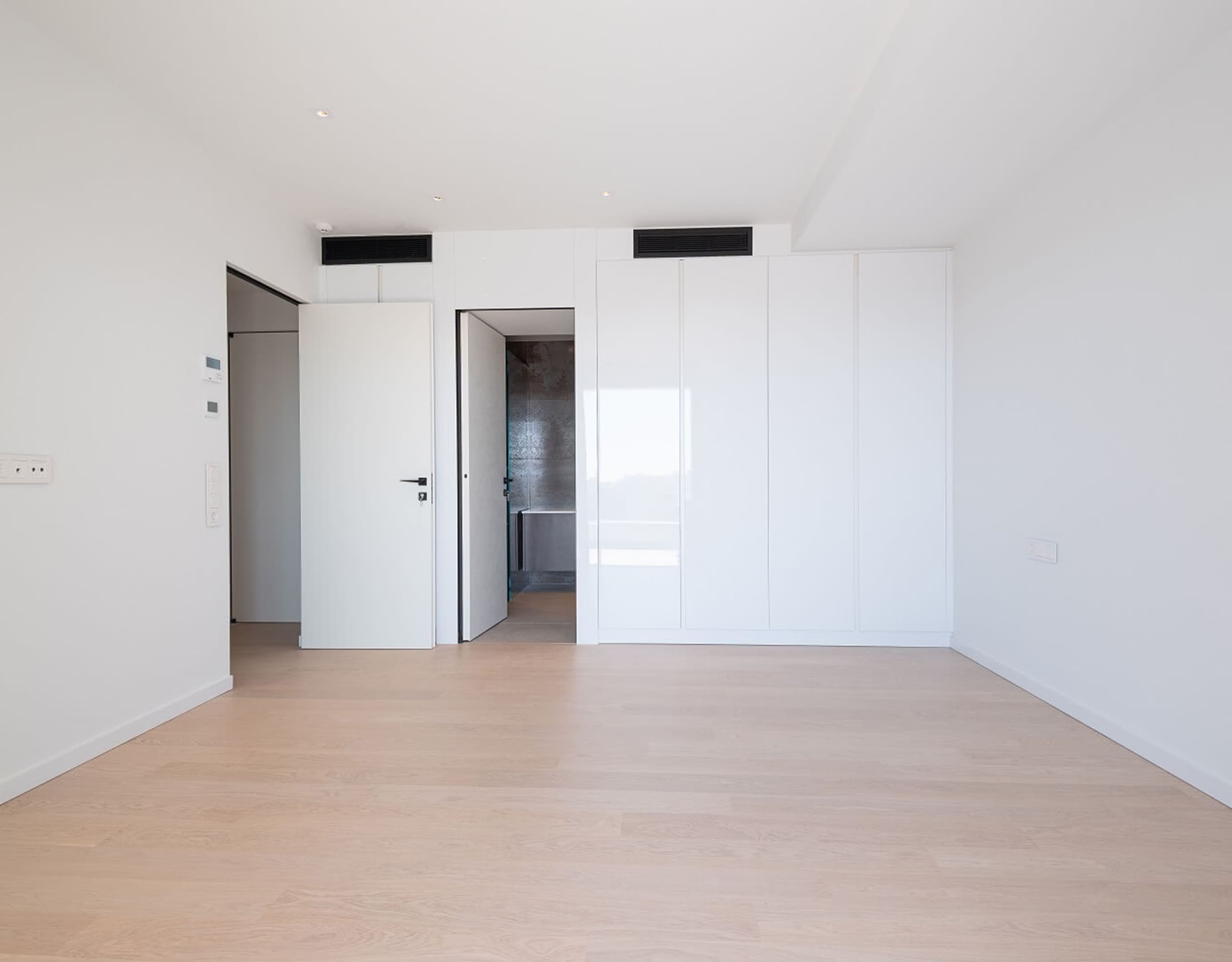 Bright open room with wood flooring and doorway to an inner hall, Athens Riviera, Greece