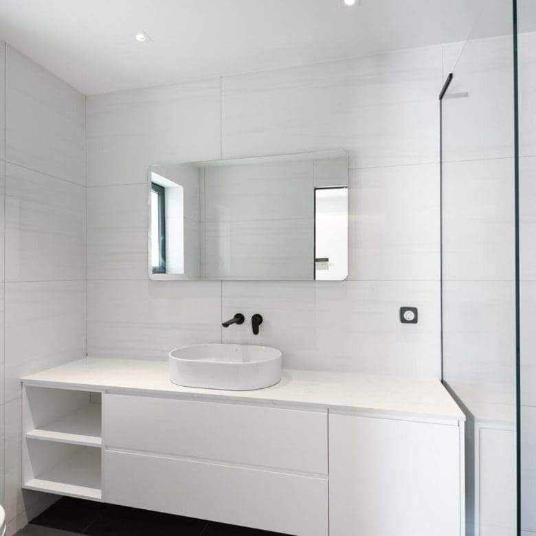 Minimal bathroom with white vanity, mirror, and walk-in shower, Athens Riviera, Greece