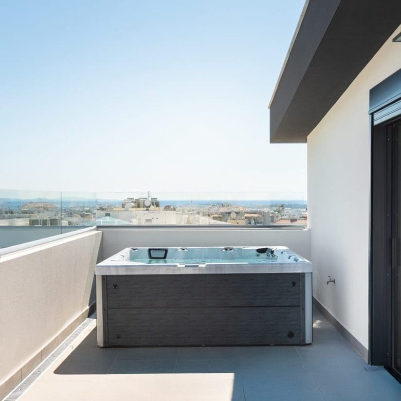 Rooftop terrace with built-in jacuzzi and open city-to-sea views, Athens Riviera, Greece
