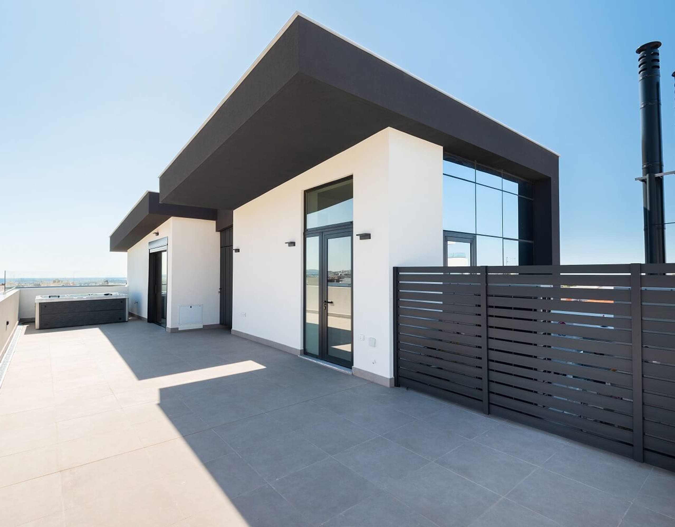 Modern rooftop structure with pergola-style roof and privacy screen, Athens Riviera, Greece