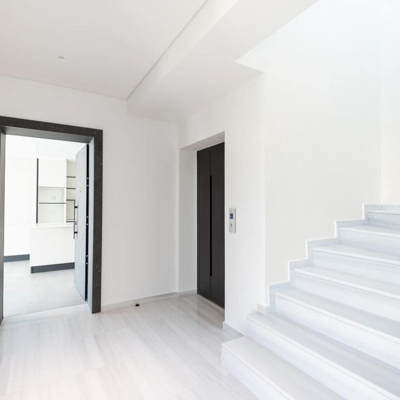 Bright interior stairwell with white steps and minimalist hallway, Athens Riviera, Greece
