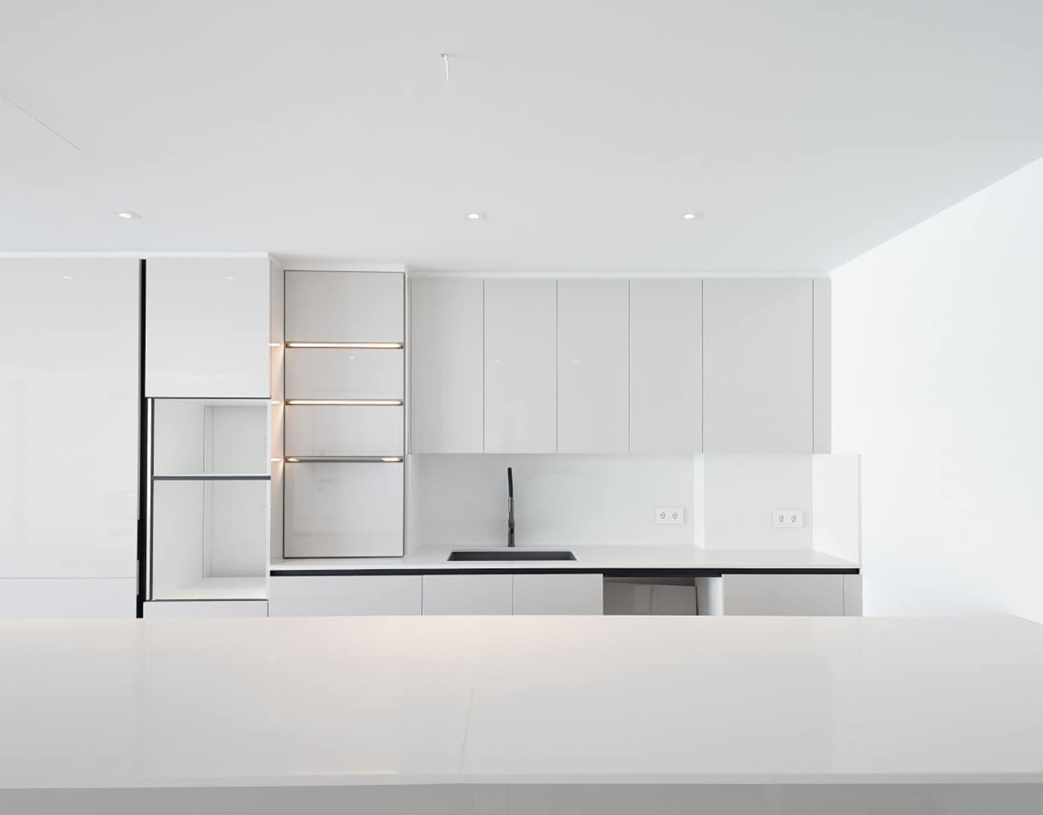 Built-in white kitchen cabinetry with open shelving detail, Athens Riviera, Greece