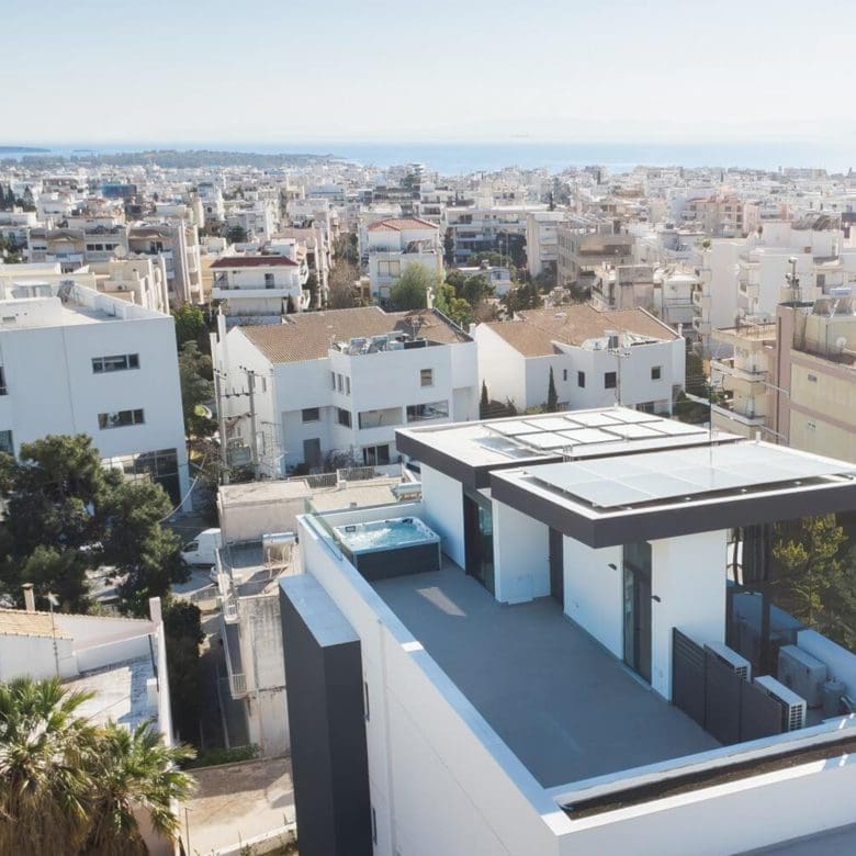 Aerial view of a modern rooftop terrace and surrounding neighborhood, Athens Riviera, Greece