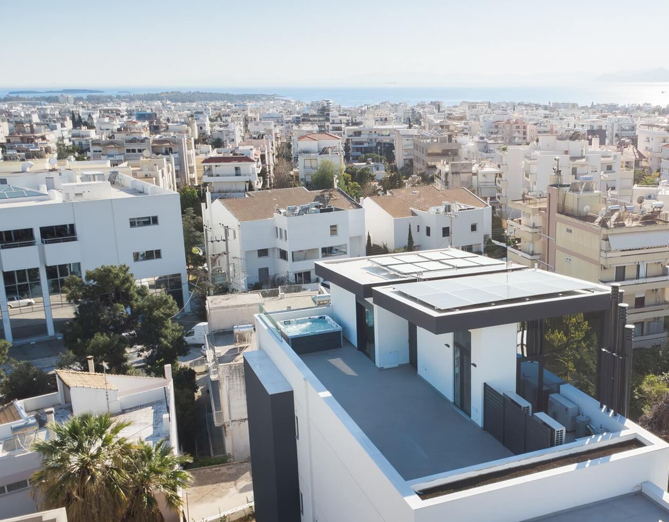 Aerial view of a modern rooftop terrace and surrounding neighborhood, Athens Riviera, Greece