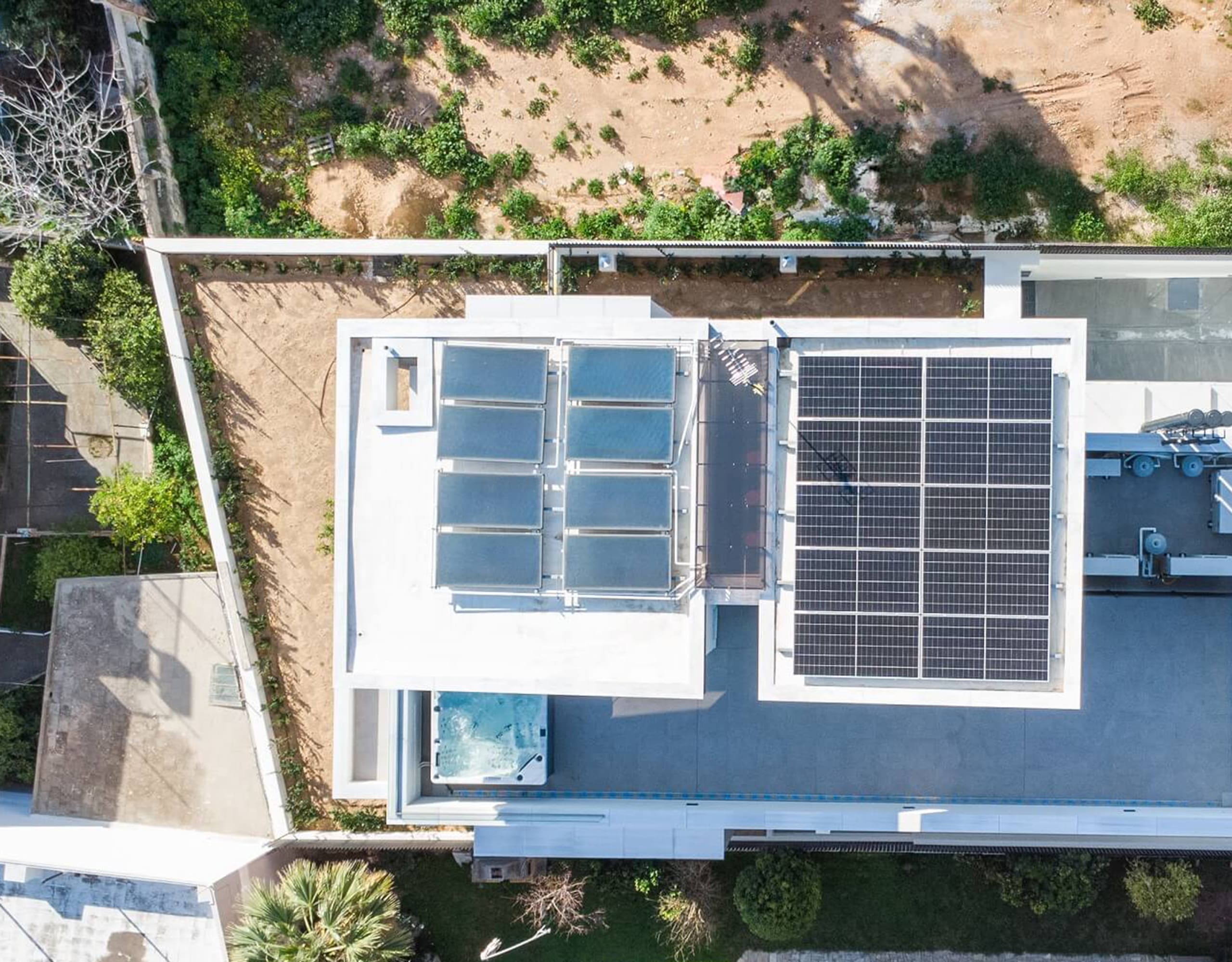 Top-down drone view of the rooftop with solar panels and terrace layout, Athens Riviera, Greece