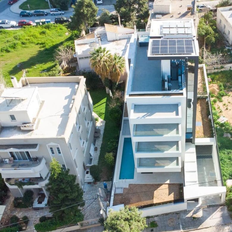 Drone view of a modern multi-level villa with terraces and pool area, Athens Riviera, Greece