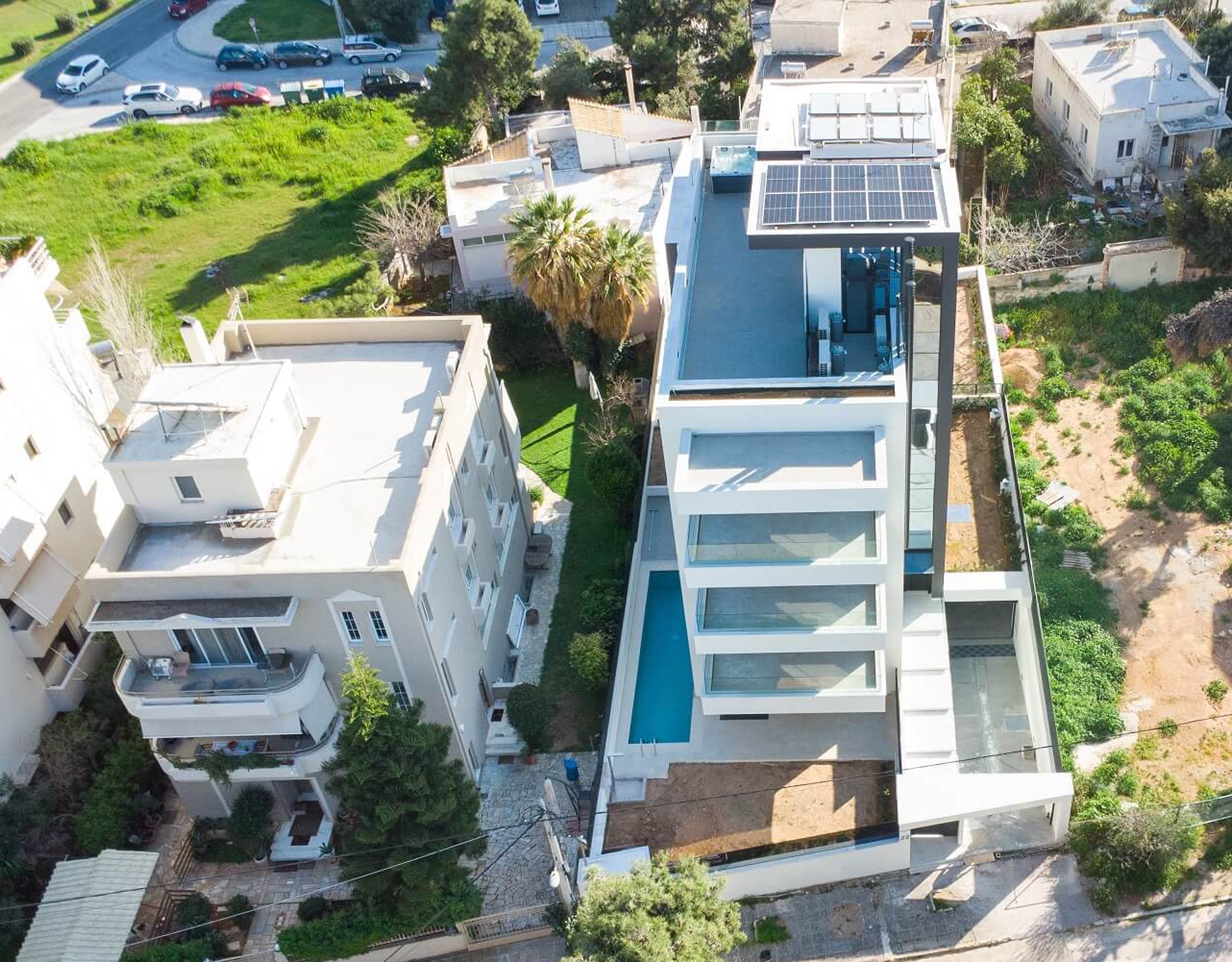 Drone view of a modern multi-level villa with terraces and pool area, Athens Riviera, Greece