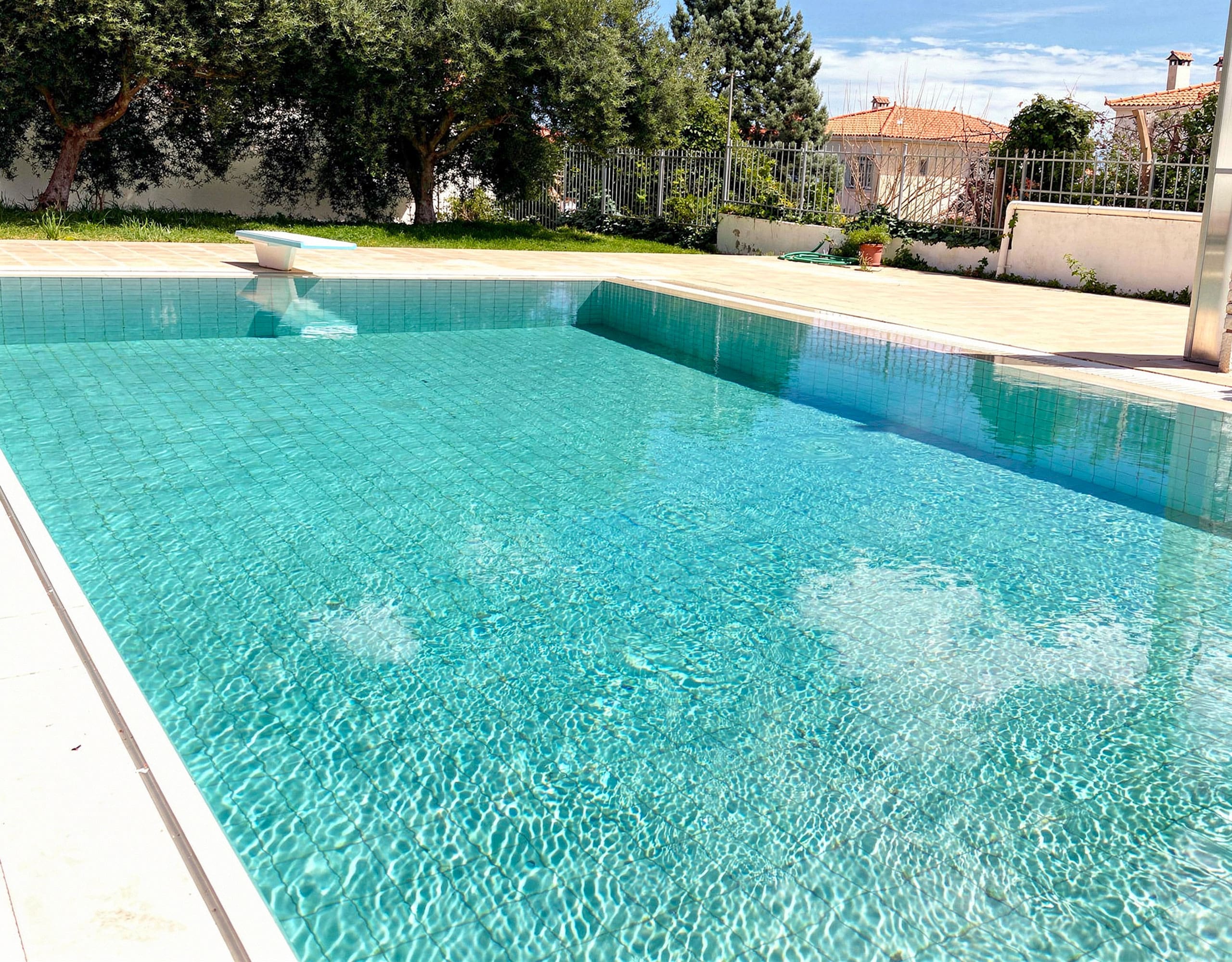 Pool and Garden View — Eretria Maisonette Long view of the private pool and garden area at the Eretria maisonette