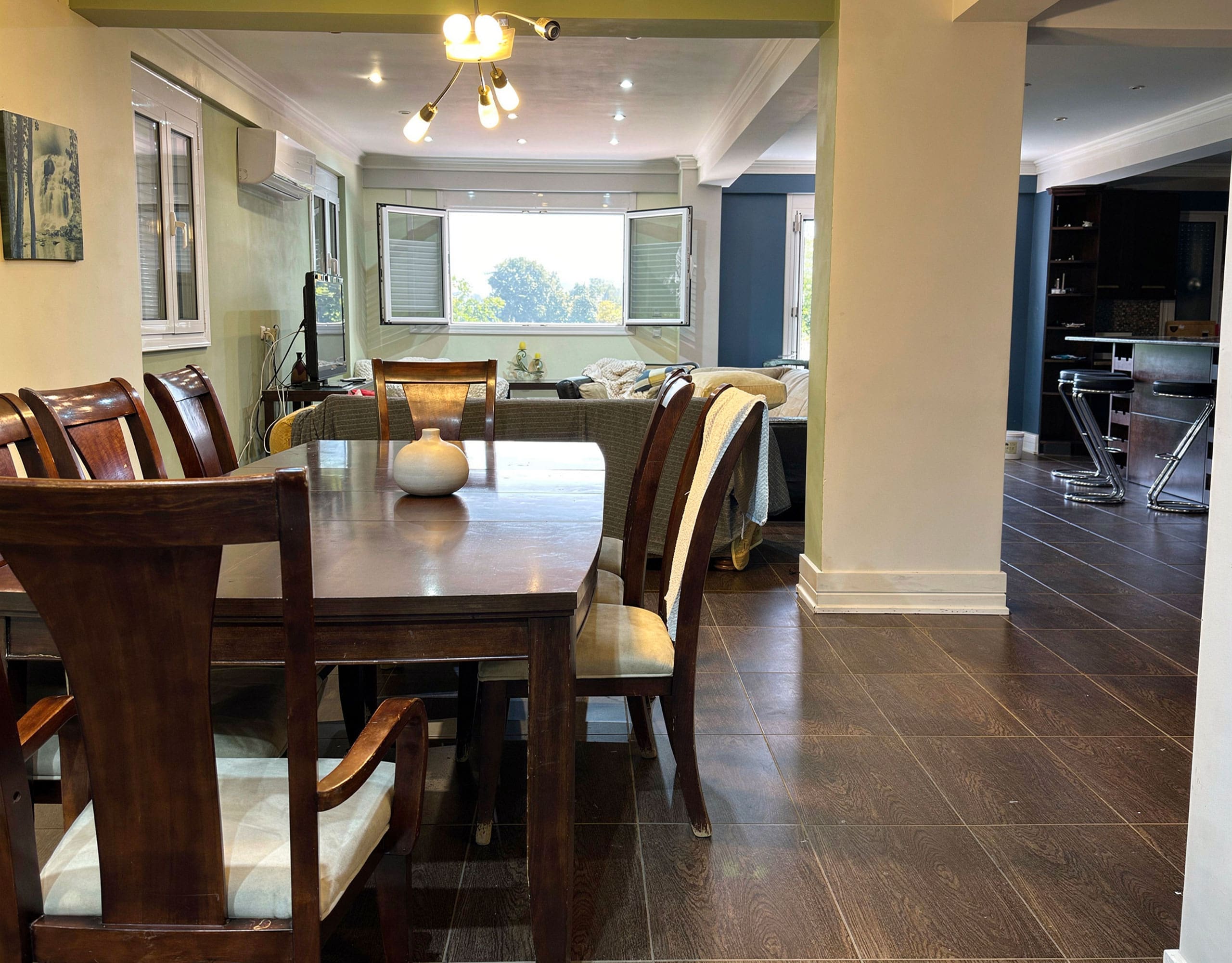 Dining Area — Ground Floor Interior Dining area within the open-plan ground floor of the Eretria maisonette