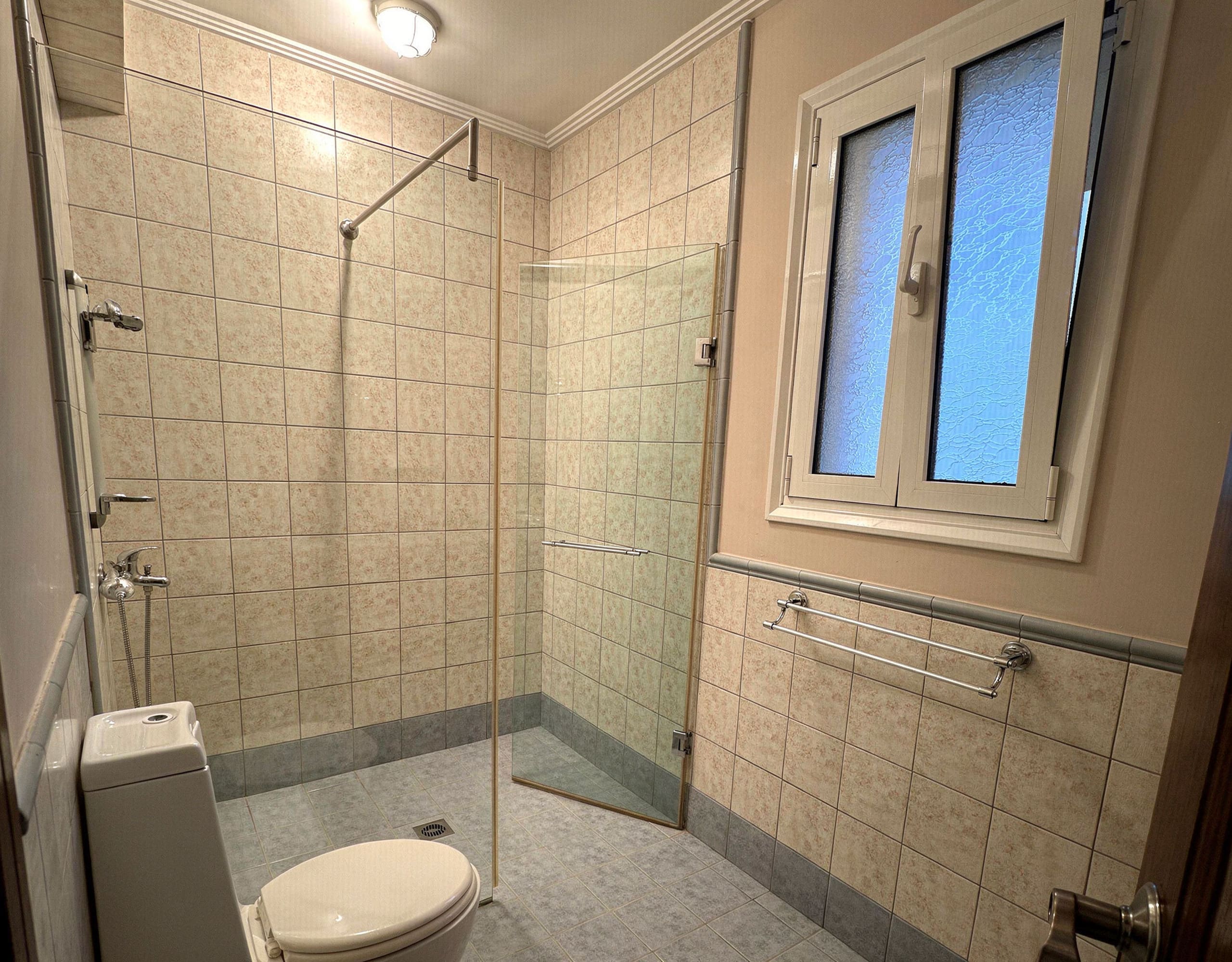Tiled Bathroom with Shower — Eretria Property Spacious tiled bathroom with shower area in the Eretria maisonette