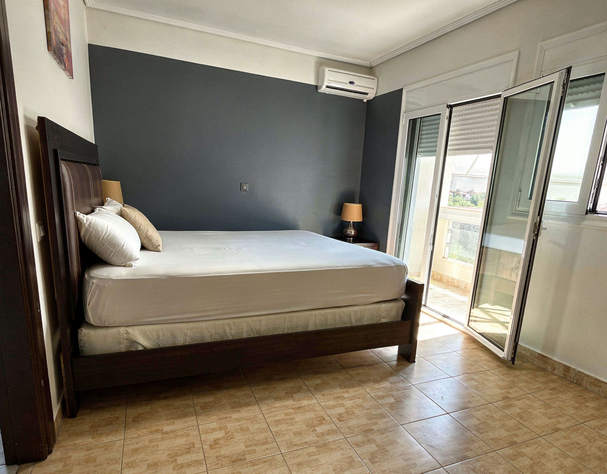 Bedroom Interior — Eretria Maisonette Bedroom with double bed and natural light in the detached maisonette in Eretria