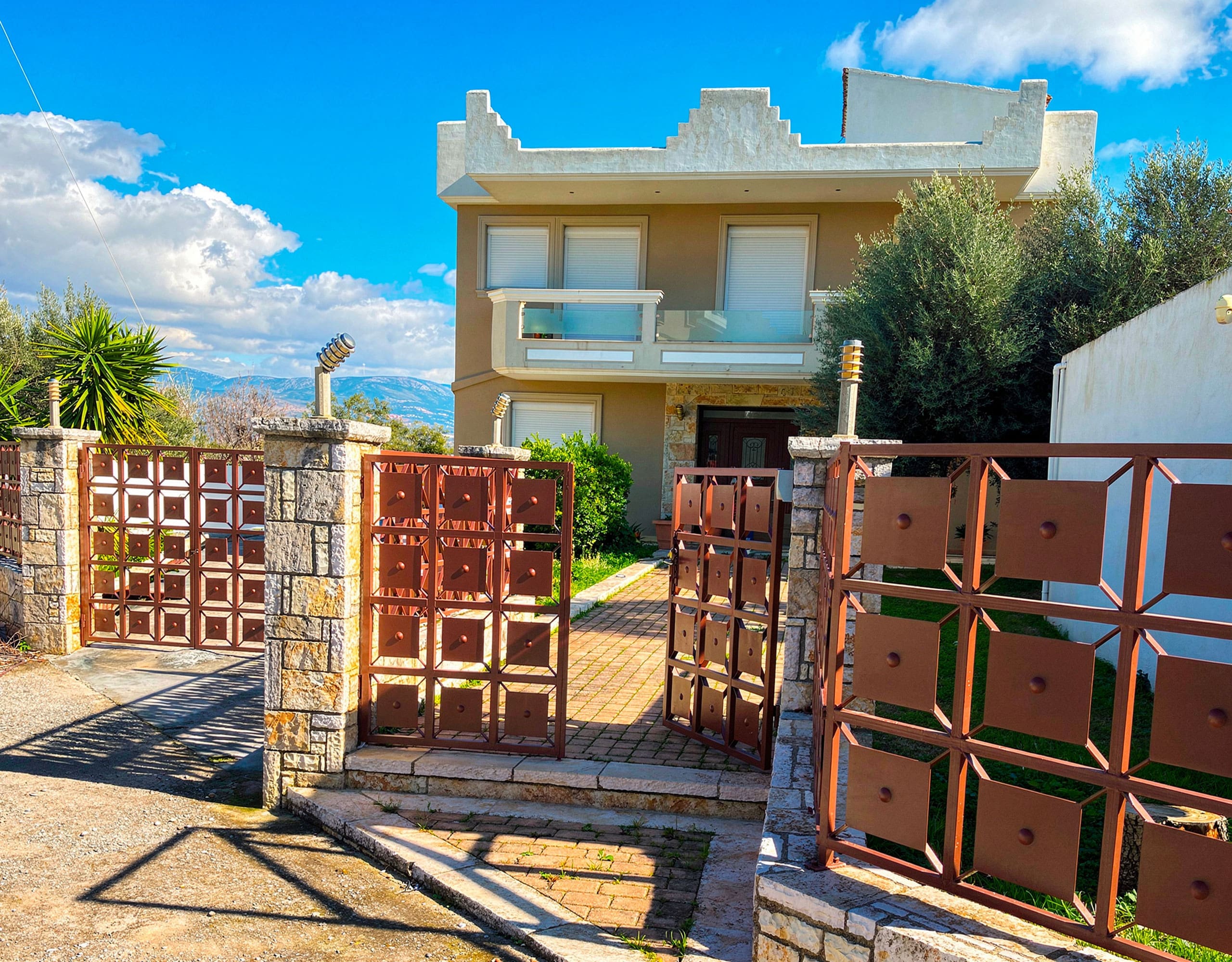 Front Entrance and Driveway — Detached Maisonette in Eretria Front entrance and driveway of the detached maisonette in Eretria, Evia