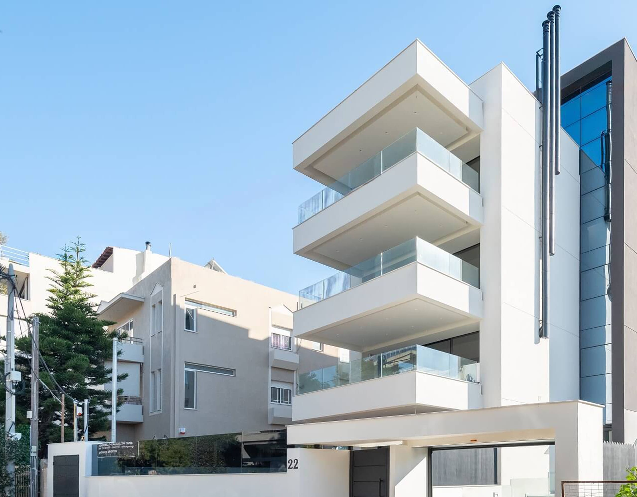 Modern new-build residential building exterior at Glyfada Golf, Athens Riviera