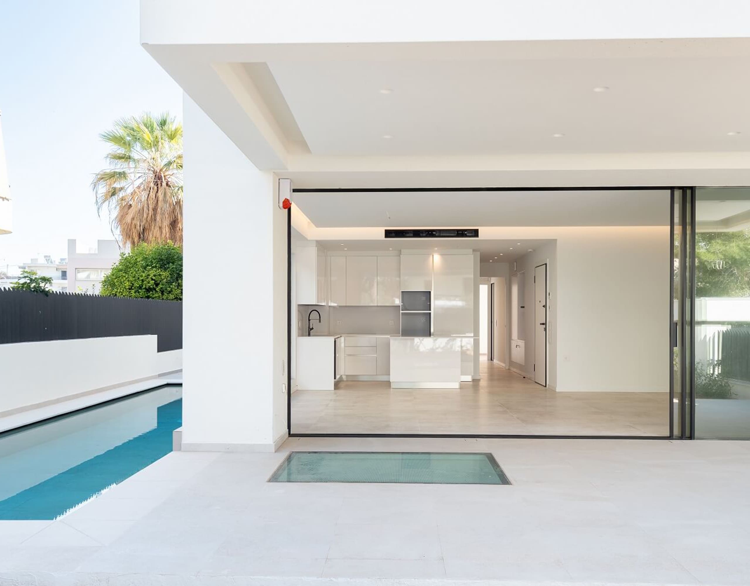 Entrance and poolside terrace at Glyfada Golf Luxury Residences, Athens Riviera