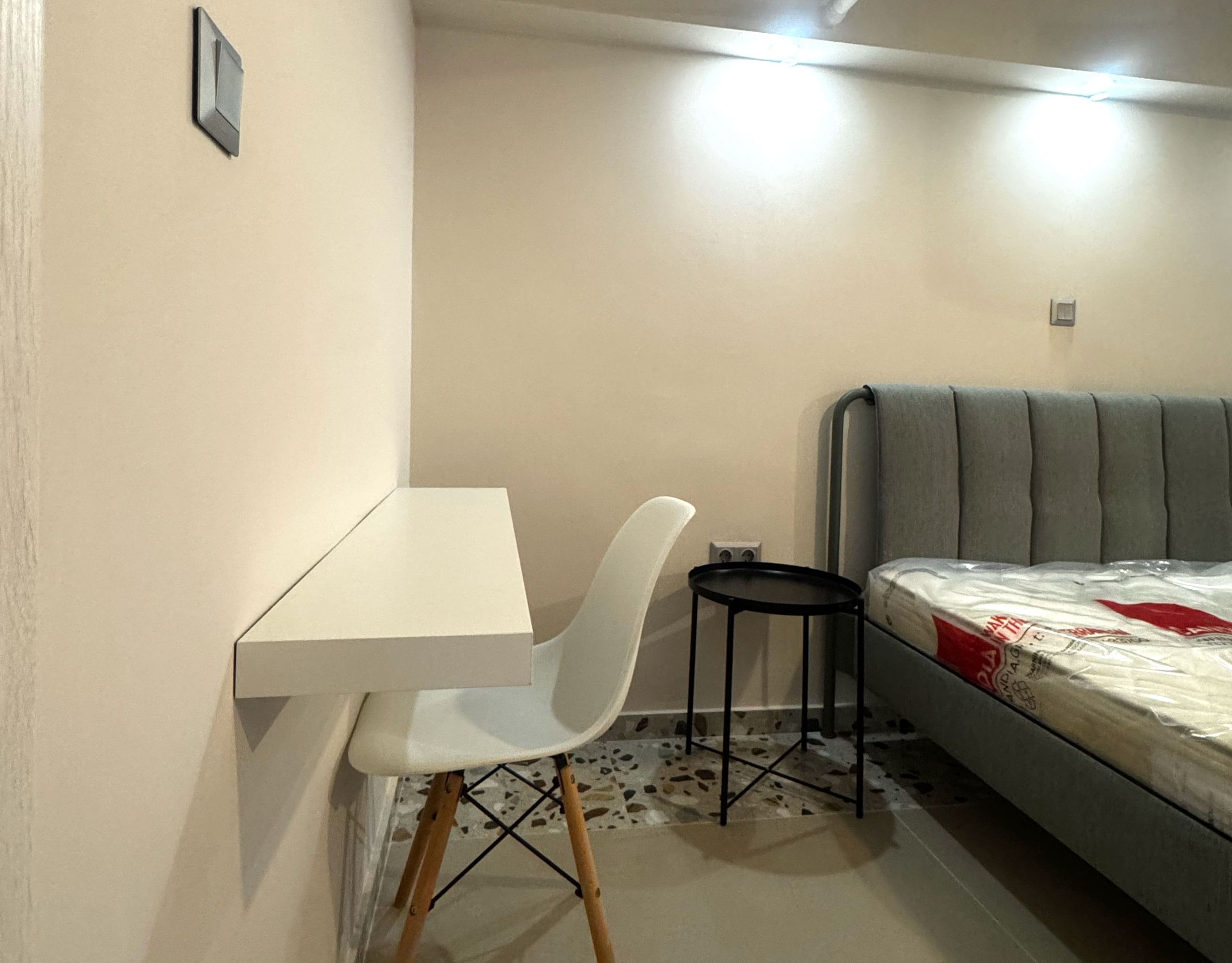 Pangrati Investment Apartment 51 sqm – Bedroom With Desk Bedroom area with double bed and compact desk setup, Pangrati, Athens, Greece