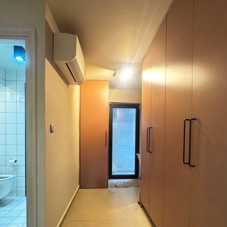 Hallway with built-in wardrobes and bathroom doorway, Pangrati, Athens, Greece