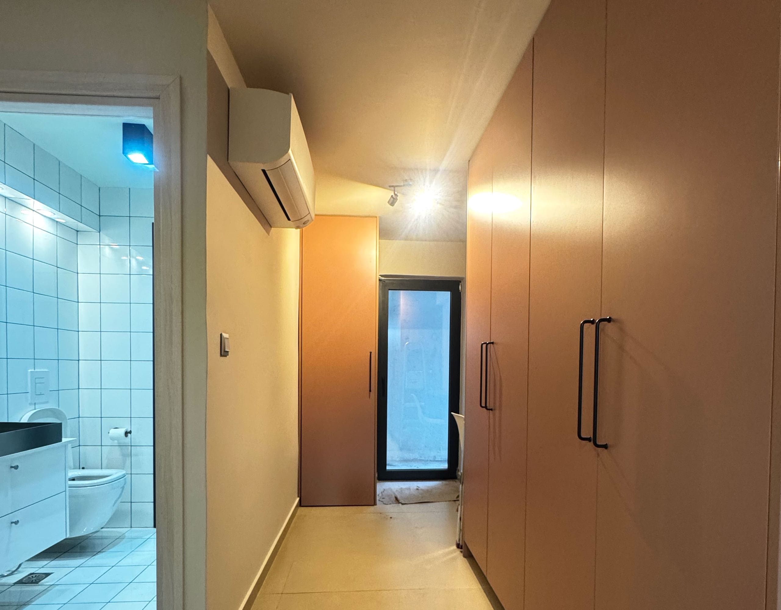 Pangrati Investment Apartment 51 sqm – Hallway With Built-In Storage Hallway with built-in wardrobes and bathroom doorway, Pangrati, Athens, Greece