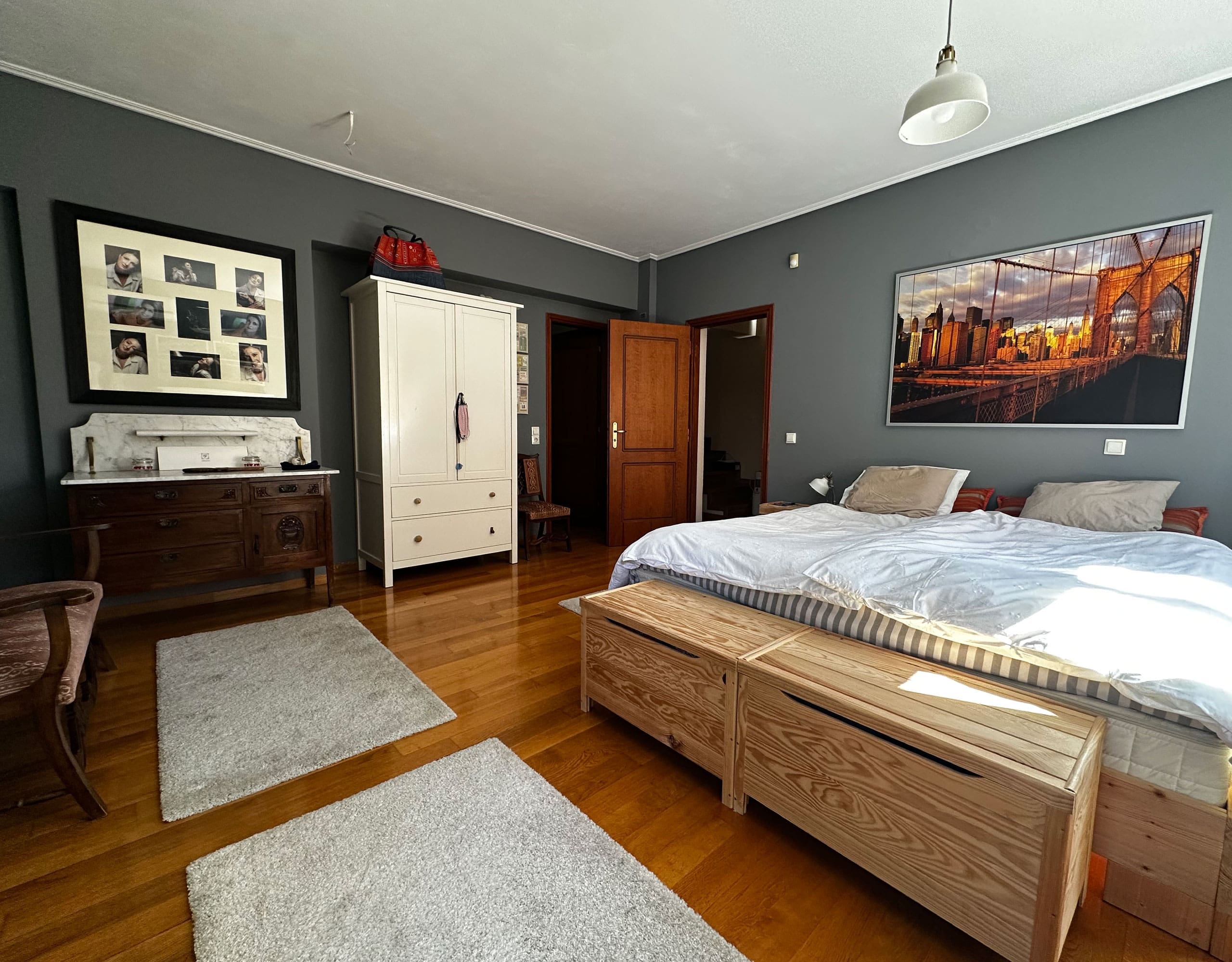 Bedroom with double bed, grey walls, and wood flooring, Thrakomakedones, Athens, Greece