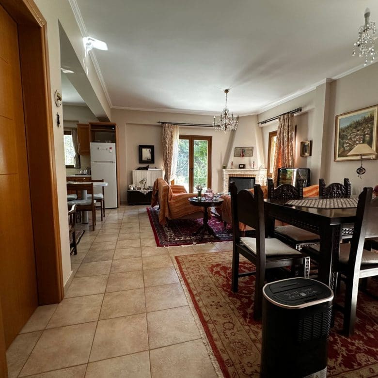 Open-plan dining and living area with tiled floor and classic furnishings, Thrakomakedones, Athens, Greece
