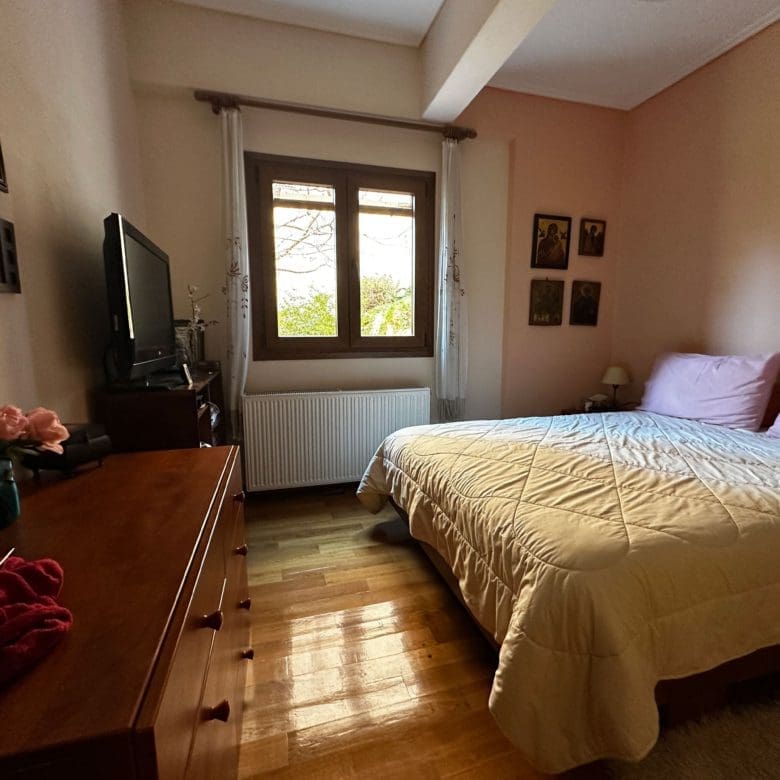 Bedroom with double bed, window, and warm wood flooring, Thrakomakedones, Athens, Greece