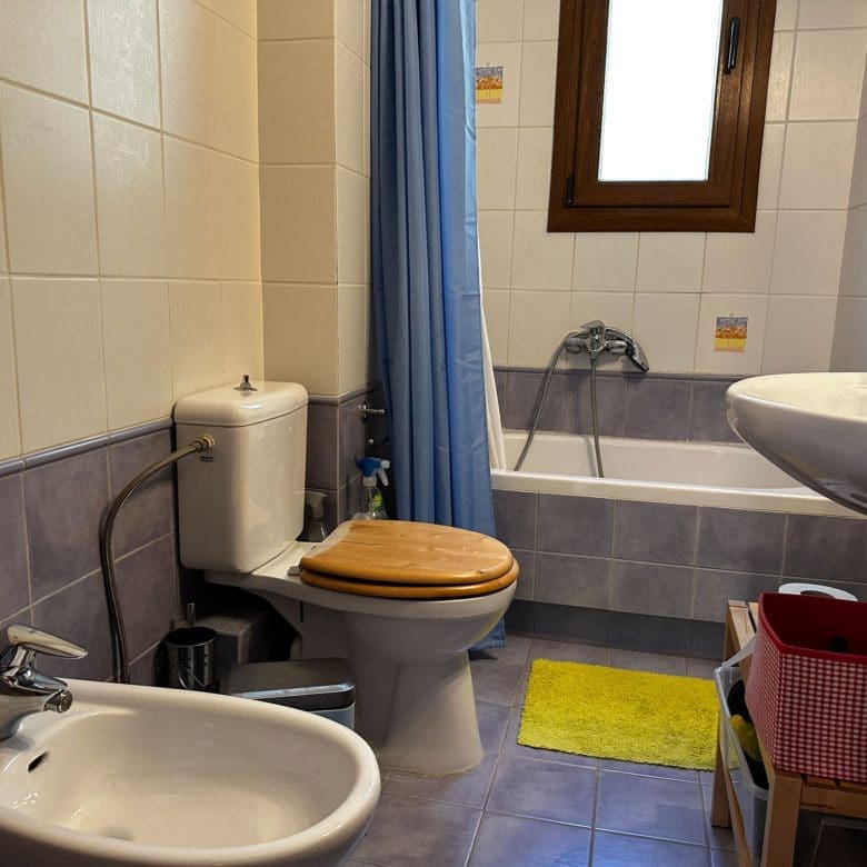 Bathroom with bathtub, sink, and tiled walls, Thrakomakedones, Athens, Greece