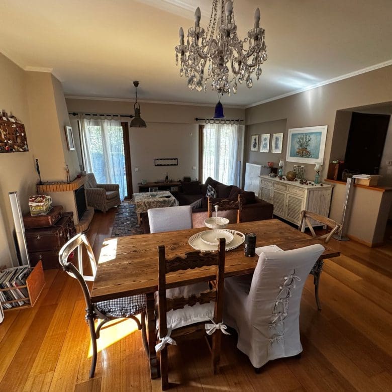 Dining area with chandelier, wood flooring, and open-plan layout, Thrakomakedones, Athens, Greece