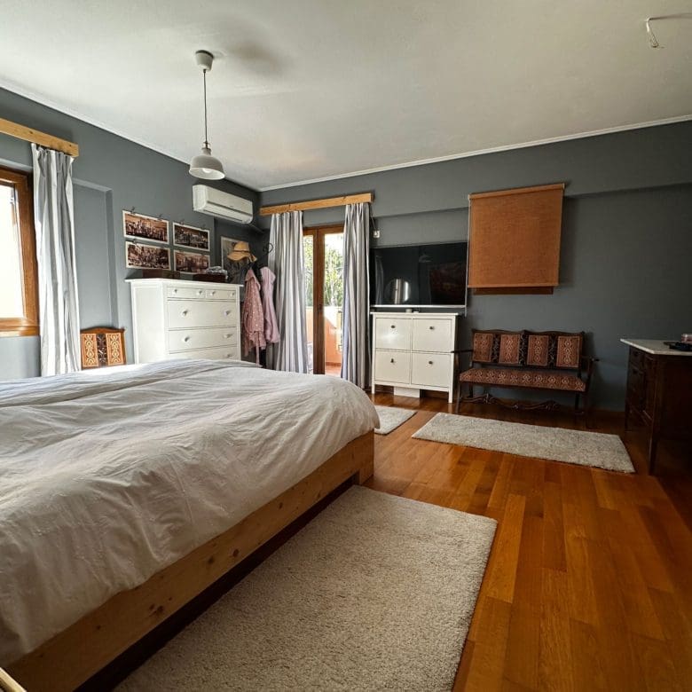 Bedroom with double bed, wardrobe storage, and wood flooring, Thrakomakedones, Athens, Greece