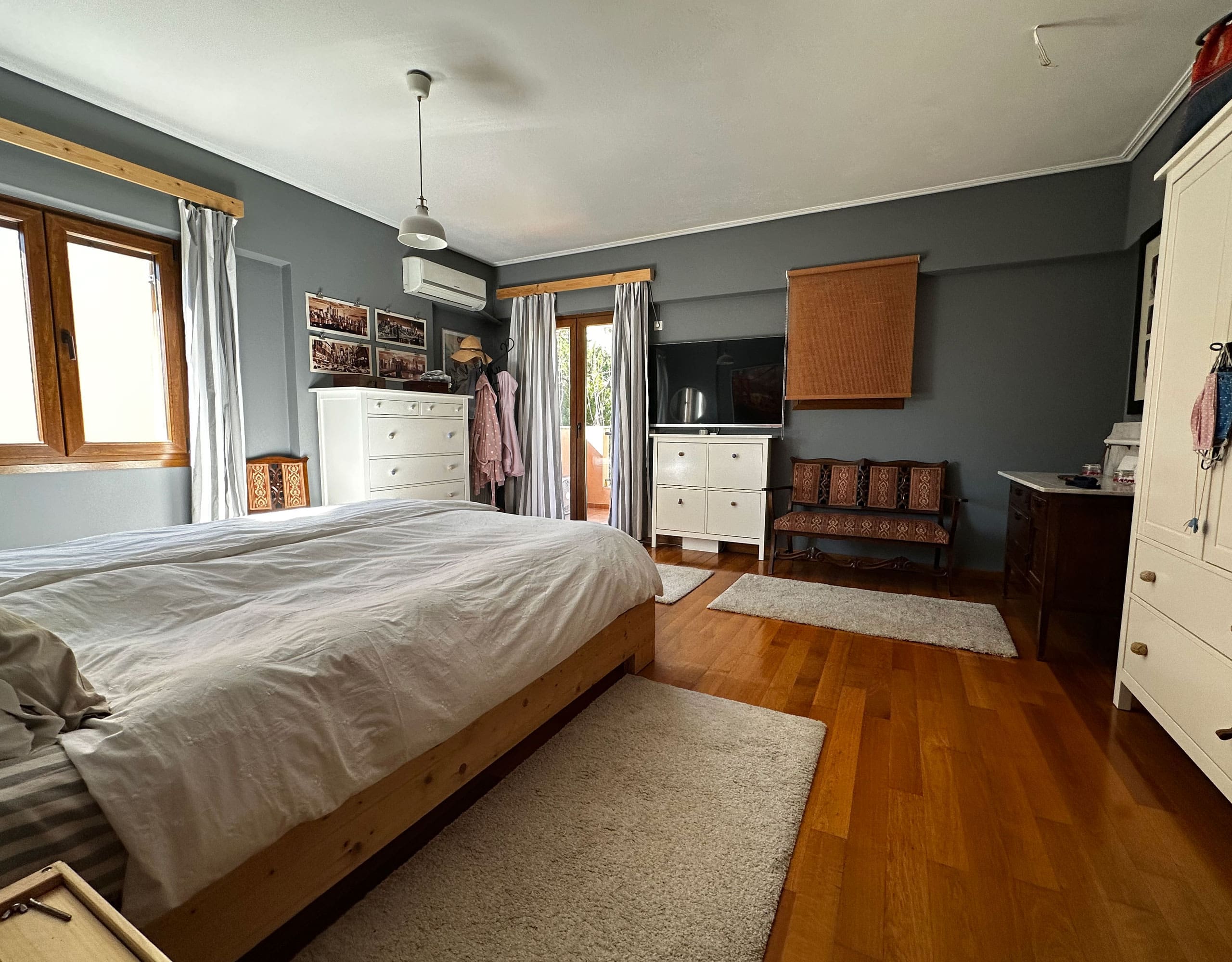 Bedroom with double bed, wardrobe storage, and wood flooring, Thrakomakedones, Athens, Greece