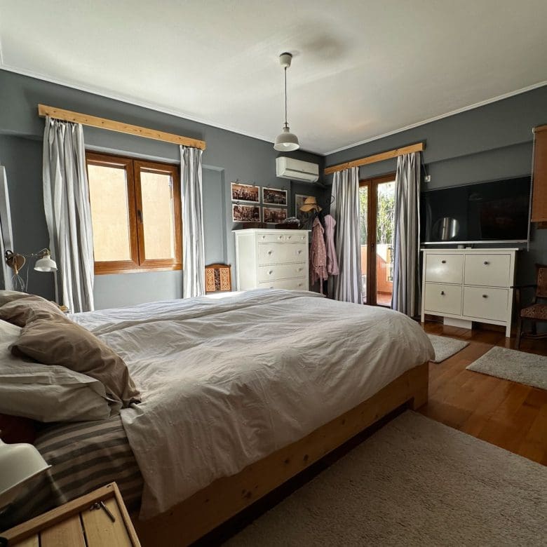 Bedroom with double bed, wardrobe, and window with curtains, Thrakomakedones, Athens, Greece
