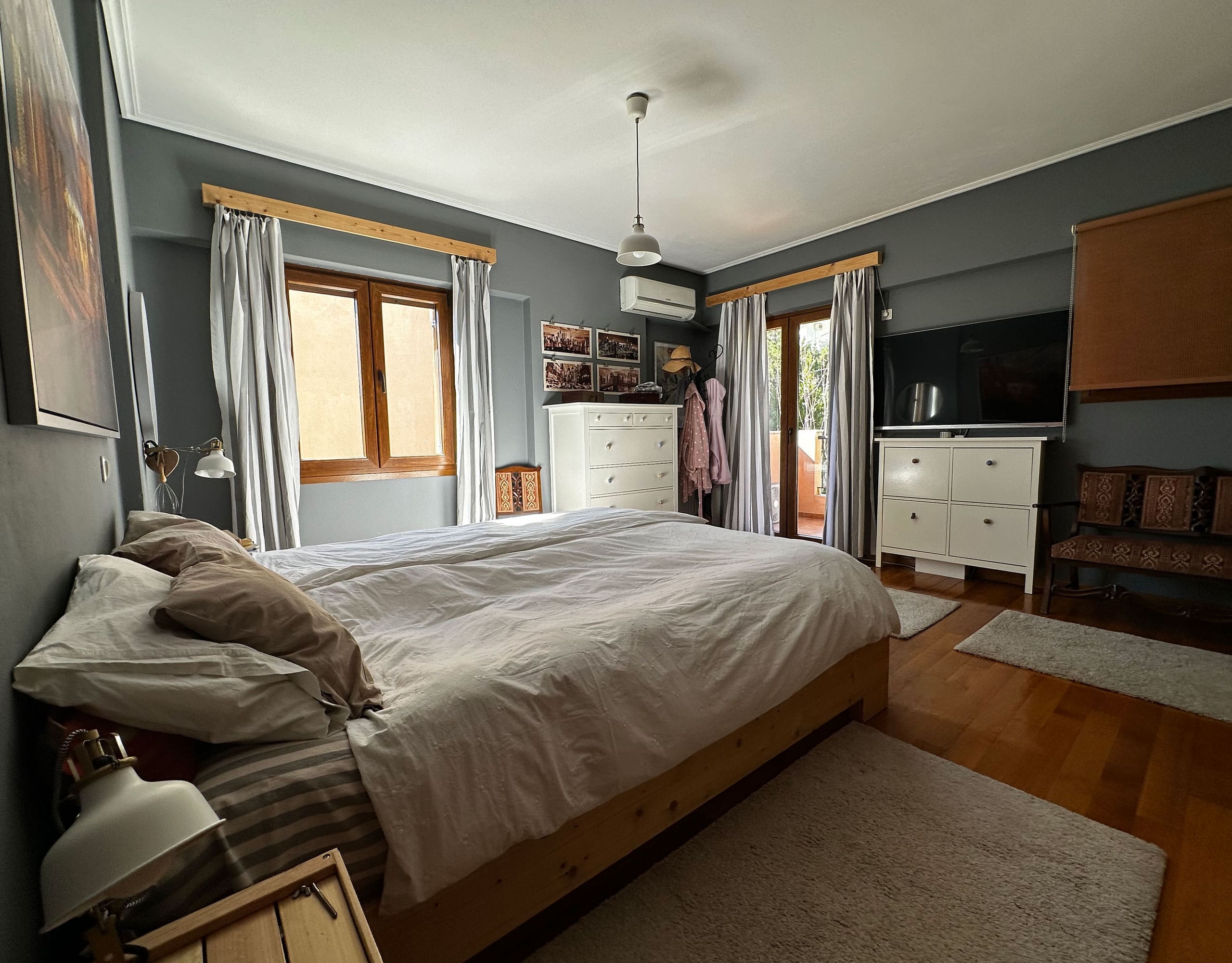 Bedroom with double bed, wardrobe, and window with curtains, Thrakomakedones, Athens, Greece