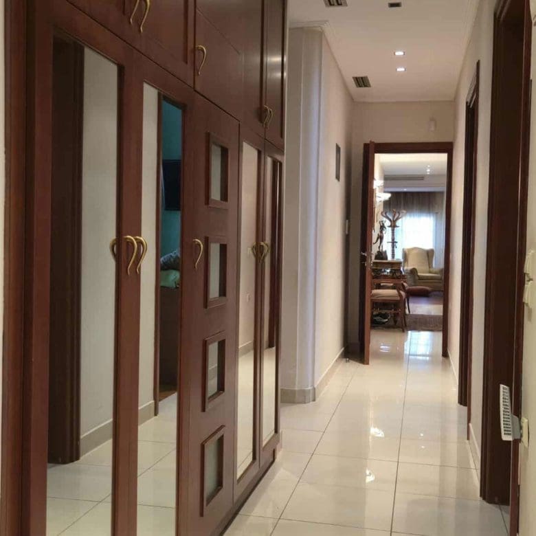 Interior hallway with built-in wardrobes and glossy floor finish, Oreokastro, Thessaloniki, Greece